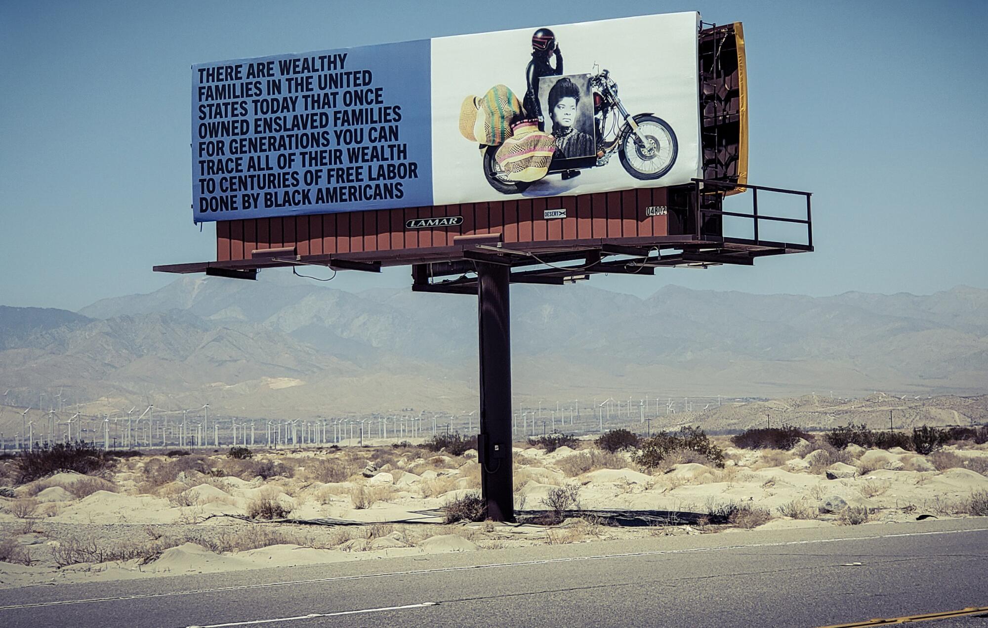 A billboard of a motorcycle and old photo links some of today's wealth to "centuries of free labor done by Black Americans."