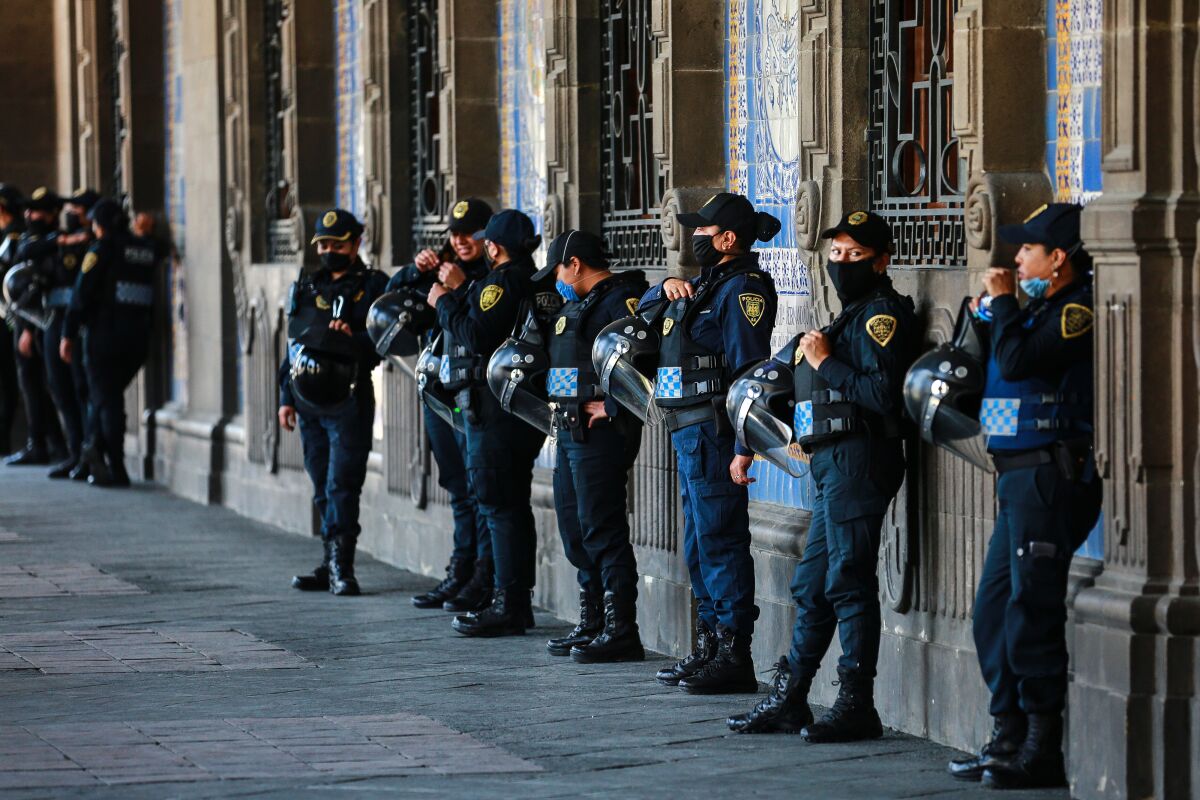 Police officers outside City Hall in Mexico City.