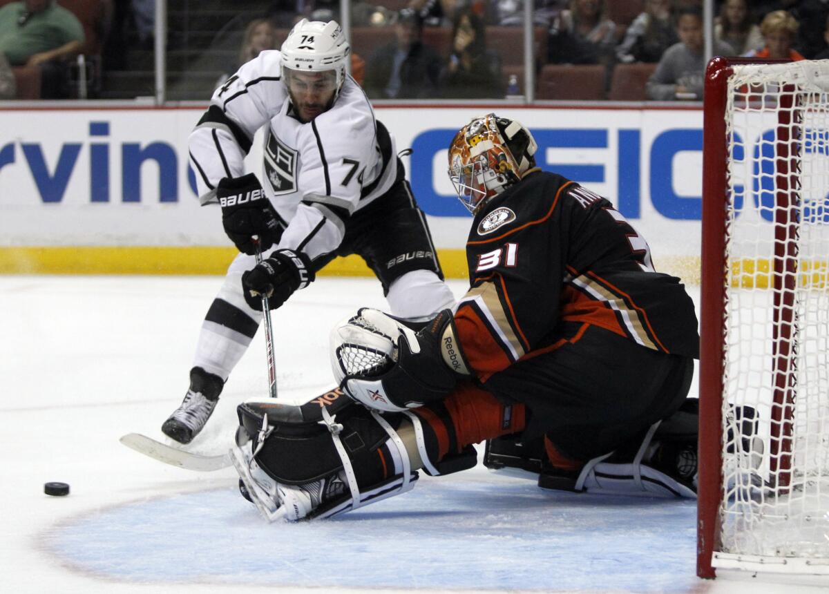 Ducks goalie Frederik Andersen stops a shot by Kings left wing Dwight King on Sept. 28.