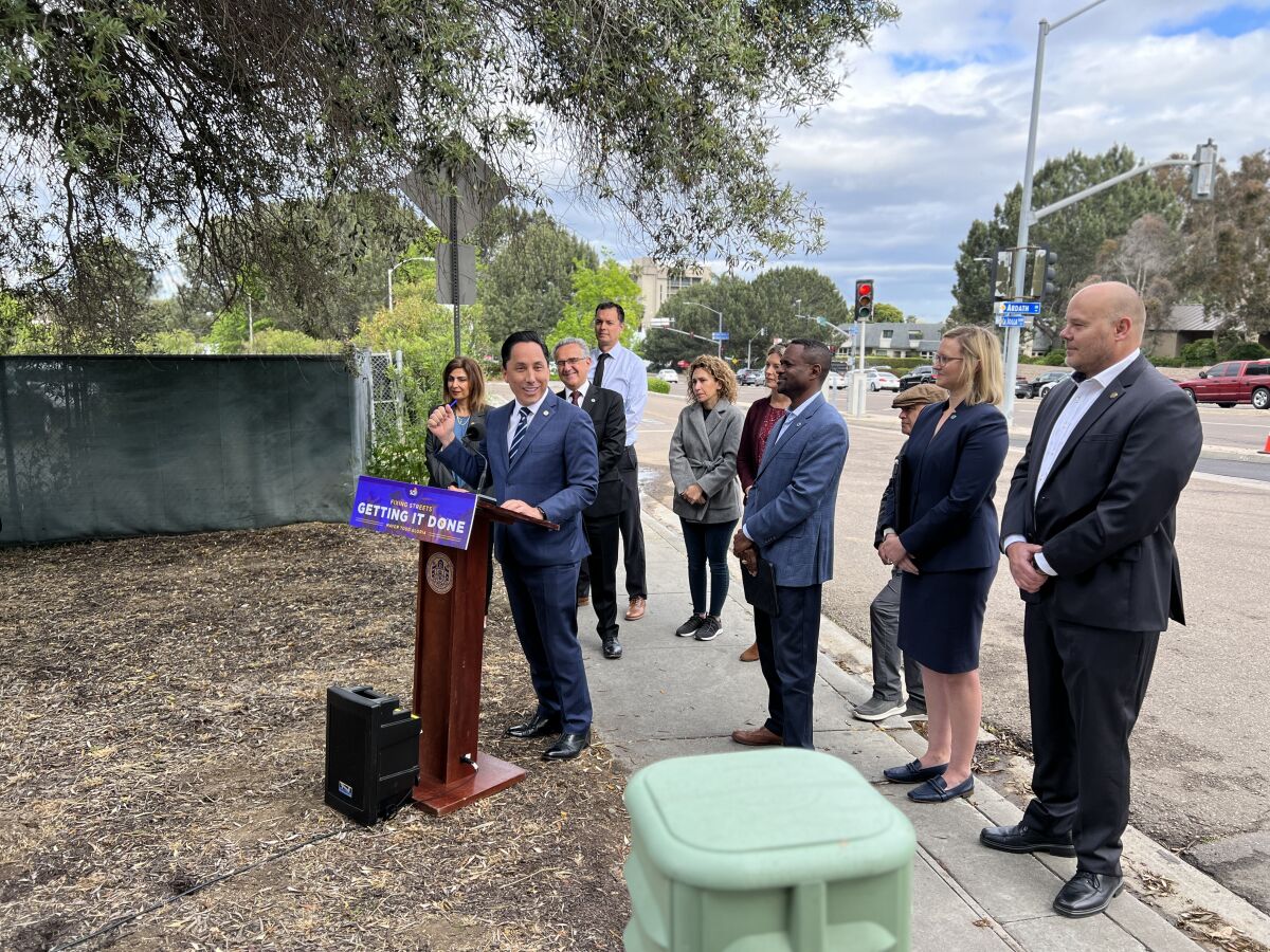 San Diego Mayor Todd Gloria speaks in La Jolla about his proposed budget for roadway repairs.