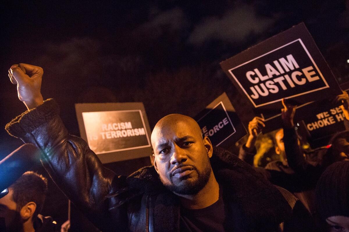 Activists protest in New York on Dec. 3, the anniversary of a grand jury's decision not to take action against NYPD Officer Daniel Pantaleo in the death of Eric Garner. A sergeant who supervised officers at the scene of Garner's death was stripped of her gun and badge.