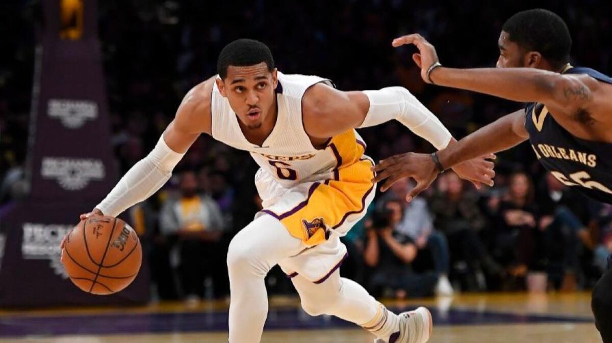 Lakers guard Jordan Clarkson, driving around New Orleans Pelicans guard E'Twaun Moore during this month, impressed Coach Luke Walton with his play Sunday against Philadelphia.