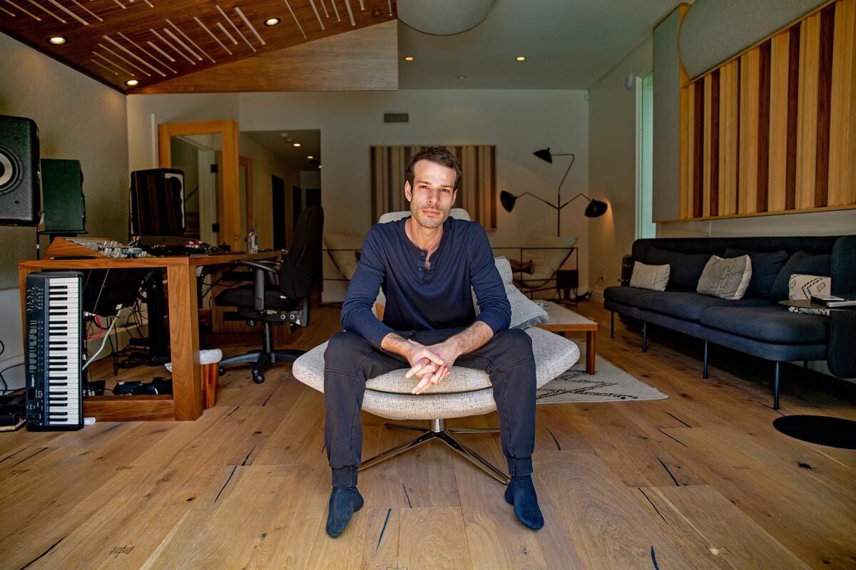 After years working in lifeless “cave dungeon” studios with no windows or sunlight, Lambroza decided to renovate the master bedroom of his 3,583-square-foot Encino home into a bright and breezy recording studio, with sliding doors leading to a lush backyard.