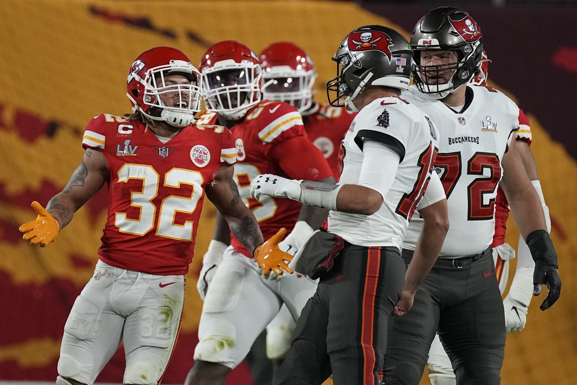 Kansas City Chiefs safety Tyrann Mathieu exchanges words with Tampa Bay Buccaneers quarterback Tom Brady.