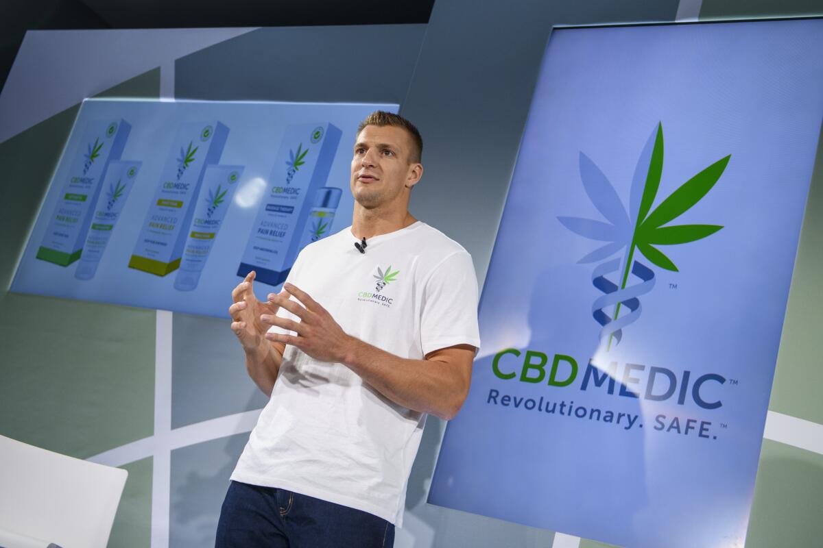 Former New England Patriots tight end Rob Gronkowski holds a news conference in August announcing his advocacy for cannabidol (CBD) and his decision to partner with a company selling CBD products.