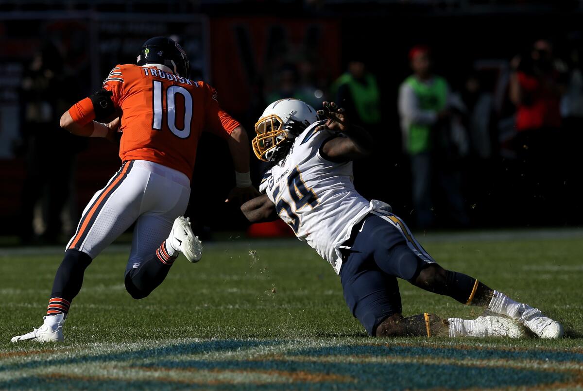 Chicago Bears quarterback Mitchell Trubisky is chased by a diving Chargers defensive end Melvin Ingram during the fourth quarter of the Chargers' 17-16 win Sunday.