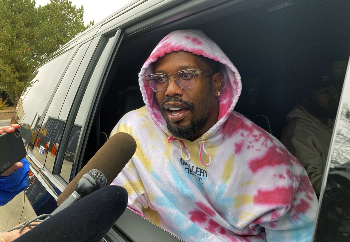 Denver Broncos linebacker Von Miller stops to talk to reporters outside the Denver Broncos headquarters after he was traded to the Los Angeles Rams for two draft picks before the NFL football trade deadline, Monday, Nov. 1, 2021, in Englewood, Colo. (AP Photo/Pat Graham)
