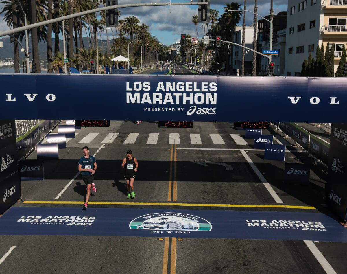 Two runners complete the 2020 Los Angeles Marathon last year