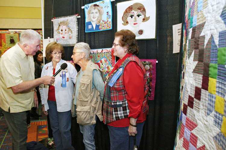 California's Gold host Huell Howser interviews, from left, Dona Garding, Rita Streimer and Violet Bos at the Glendale Quilt Guild 32nd Annual Show at the Burbank Airport Marriott on Friday, March 18, 2011. Garding and Bos are Quilting students at Streimer's class at Glendale College.