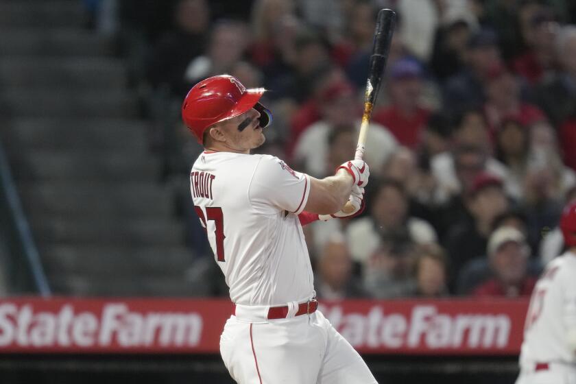 Los Angeles Angels' Mike Trout hits a home run during the fifth inning of a baseball game.