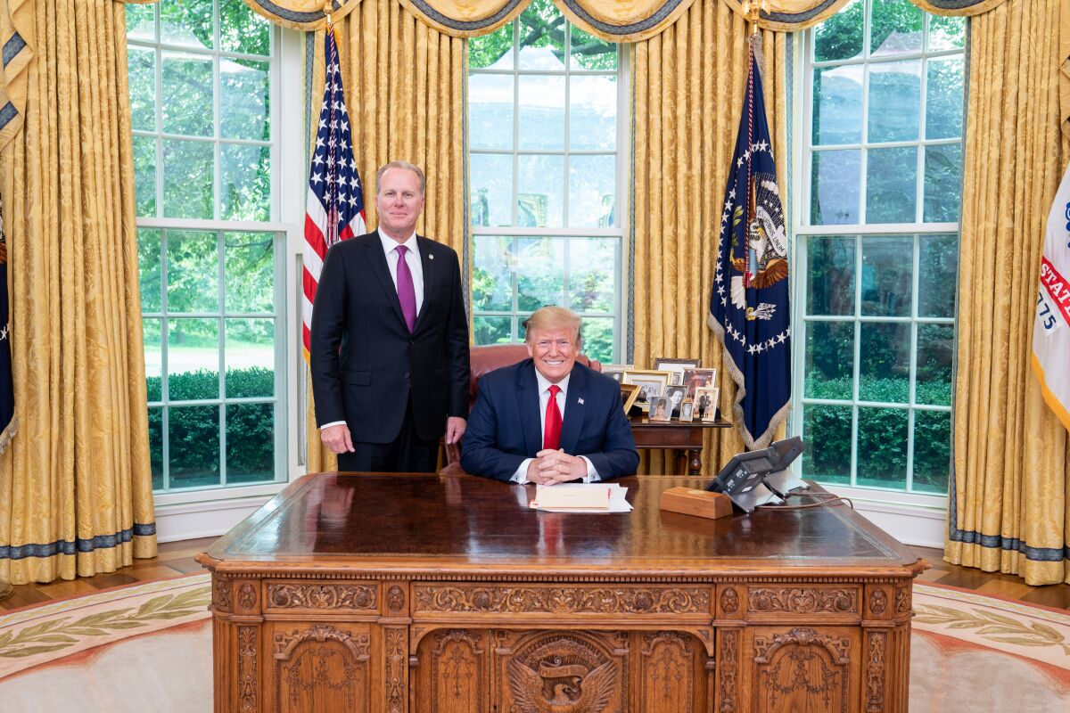Then-San Diego Mayor Kevin Faulconer stands next to President Trump in the Oval Office in June 2019