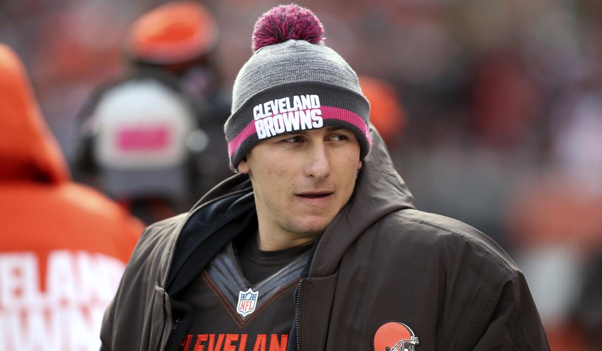 Cleveland Browns quarterback Johnny Manziel watches from the sidelines during a game against the Denver Broncos on Sunday.