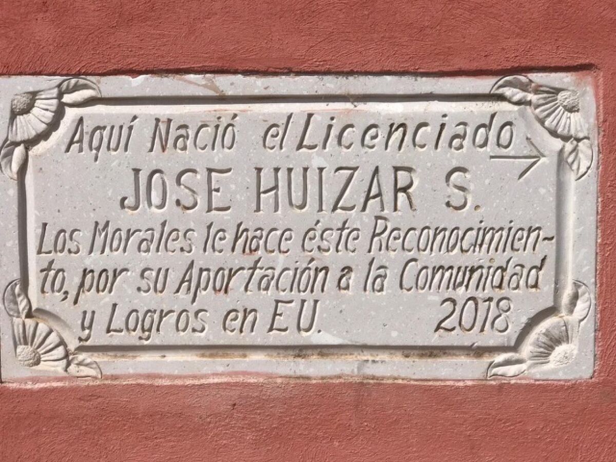 A concrete plaque honoring Jose Huizar