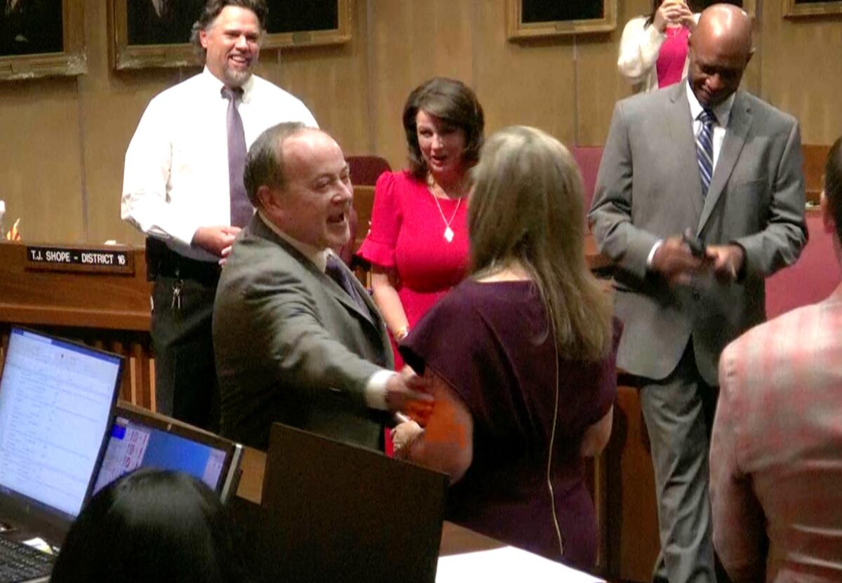 Arizona Supreme Court Justice Clint Bolick administering the oath of office to his wife,