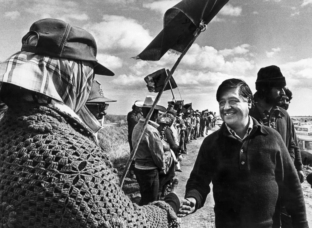 Feb. 1, 1979: Cesar Chavez talks with United Farm Workers members during a lettuce strike in the Imperial Valley near El Centro.