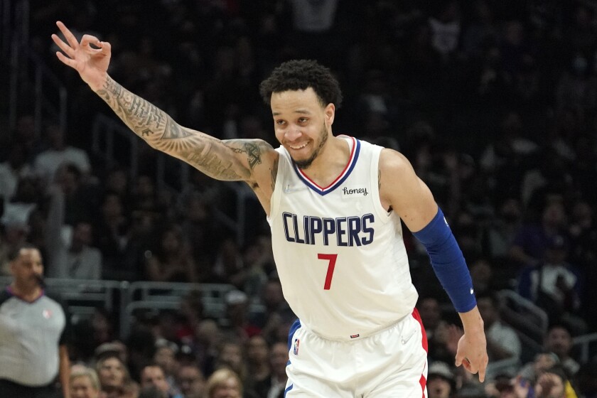 Los Angeles Clippers guard Amir Coffey gestures after hitting a three-point shot during the second half of an NBA basketball game against the Oklahoma City Thunder Sunday, April 10, 2022, in Los Angeles. (AP Photo/Mark J. Terrill)