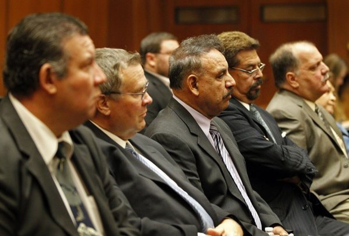 Listening at a preliminary hearing are, from left, former Bell council members Luis Artiga, George Cole, Oscar Hernandez, George Mirabal, Victor Bello and Teresa Jacobo. In March, Artiga was found not guilty on all charges; the others were found guilty on some charges and could face a retrial on others.