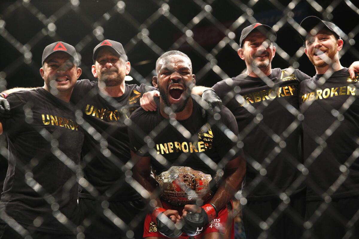 Light-heavyweight champion Jon Jones lets out a yell as he celebrates with his team after a unanimous-decision victory over Daniel Cormier in January at the MGM Grand Garden Arena in Las Vegas.