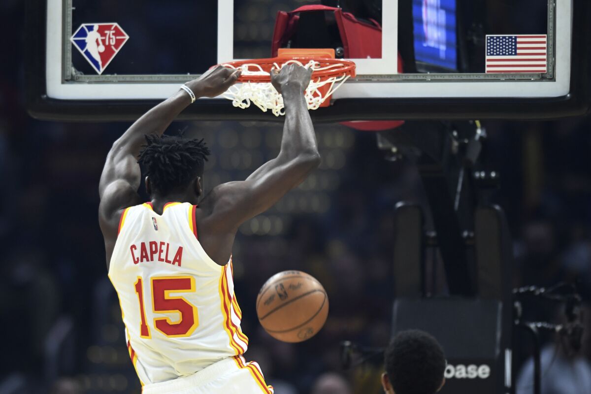 The Atlanta Hawks' Clint Capela dunks during the first half April 15, 2022, in Cleveland. 