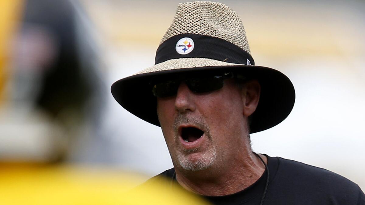 Steelers defensive coordinator Keith Butler gives instruction during a workout at training camp.