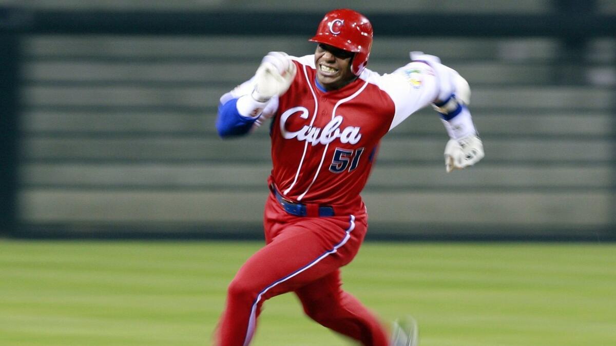 Cuba's Yoennis Cespedes runs to third base during a game against Japan in the 2009 World Baseball Classic.