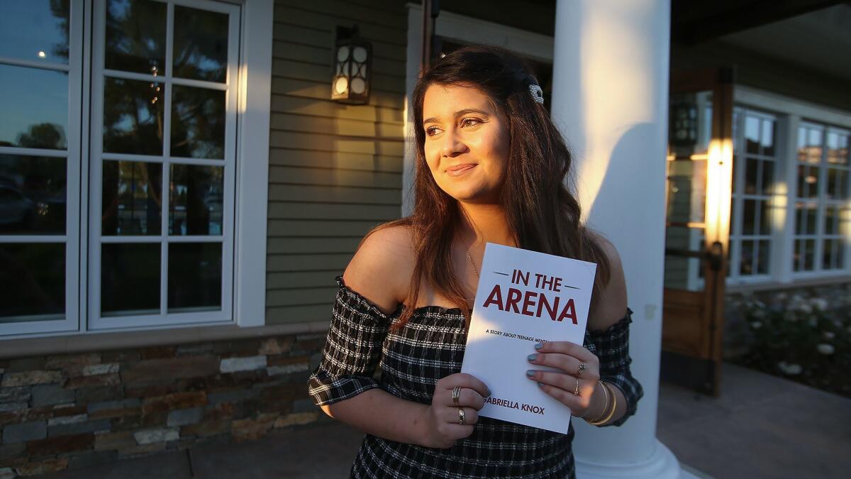 Corona del Mar High School junior Gabriella Knox wrote her book "In the Arena" after the suicide of a fellow student last year. Proceeds will benefit Patrick’s Purpose, a nonprofit founded by the student's mother that is geared toward mental health education.