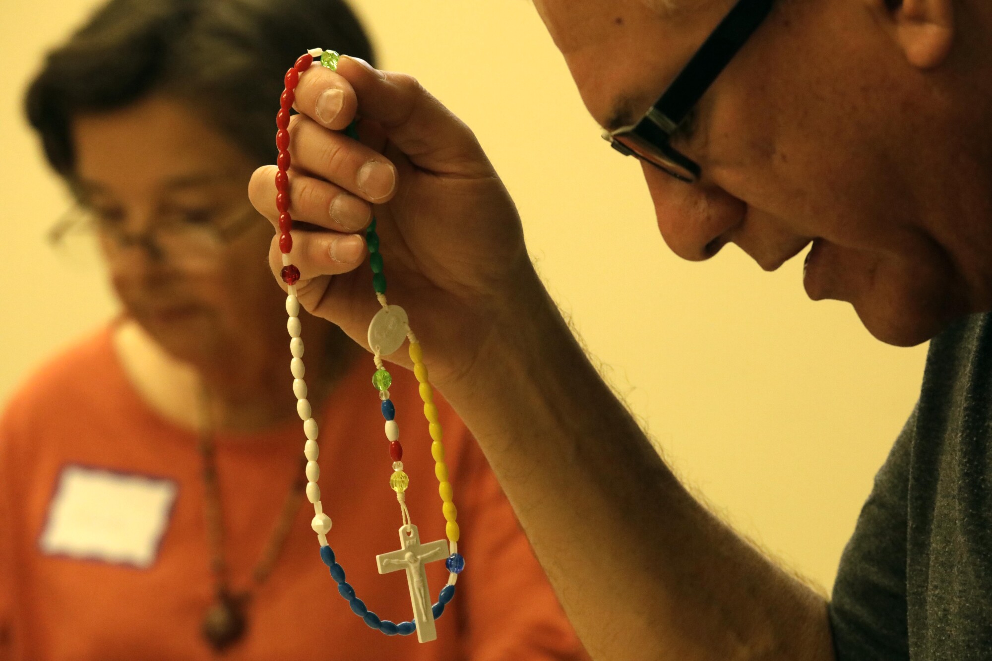 Ray Martinez and Martha Olivares recite the rosary during a meeting of St. Dymphna's Disciples.