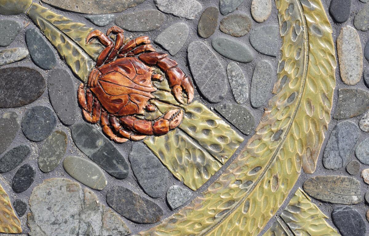 A crab and kelp are part of Scott and Naomi Schoenherr's "Lunar Tides" in Heisler Park.