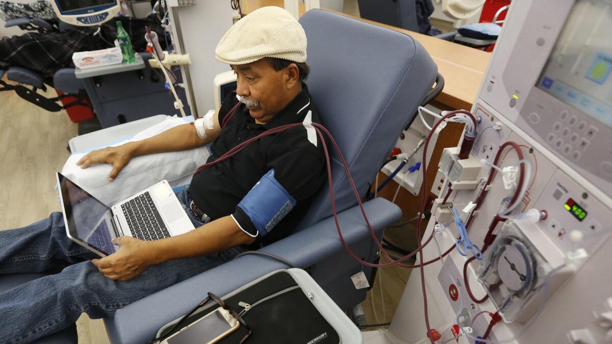 In this Sept. 24 photo, Adrian Perez undergoes dialysis at a DaVita Kidney Care clinic in Sacramento. If approved by voters in November, Proposition 8, could limit dialysis clinics’ profits.