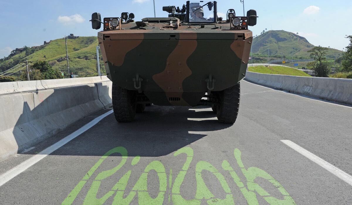 Brazilian soldiers make a convoy during the inauguration of the BRT Transolimpica, an express road that connects Deodoro and Barra da Tijuca.