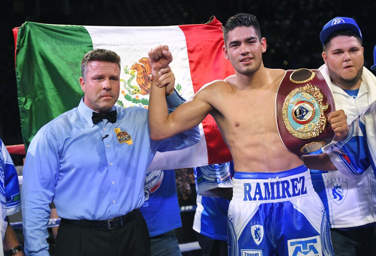 Gilberto Ramirez, of Mexico, poses with his belt after defeating Maxim Bursak, of Ukraine, in a WBO world championship super middleweight bout, Saturday, April 22, 2017, in Carson, Calif. (AP Photo/Mark J. Terrill)