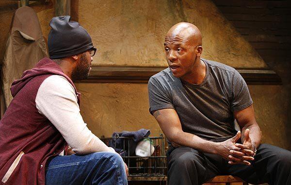 Larry Bates, left, portrays Booth in Suzan-Lori Parks' "Topdog/Underdog" opposite Curtis McClarin as Lincoln at South Coast Repertory in Costa Mesa.