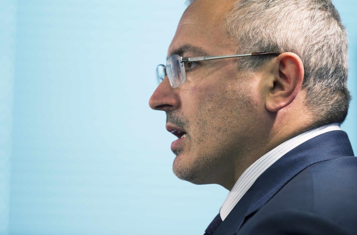 Kremlin critic and former oil tycoon Mikhail Khodorkovsky, seen here speaking to the Atlantic Council in Washington on June 17, has been named by the Russian Investigative Committee as a possible suspect in a 1998 killing.
