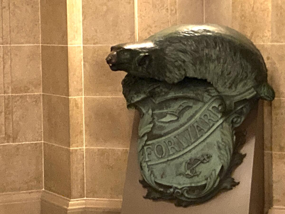 FILE - A Badger and Shield statue is displayed outside the governor's Capitol office in Madison, Wis., on, Jan. 27, 2021. The Navy has decided to let Wisconsin keep its beloved badger statue for another 50 years, scrapping plans to move the sculpture to an East Coast museum. (AP Photo/Todd Richmond File)