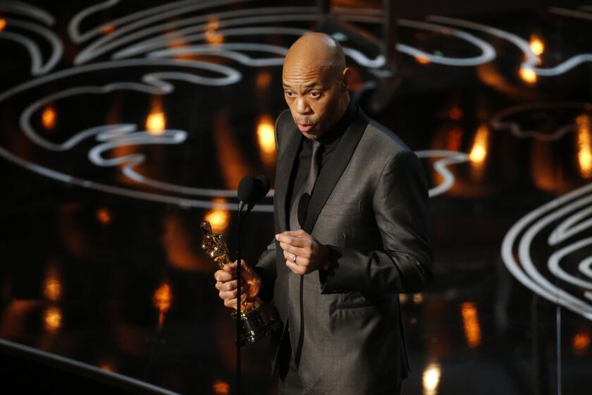 John Ridley accepting his Oscar for adapted screenplay for "12 Years a Slave."