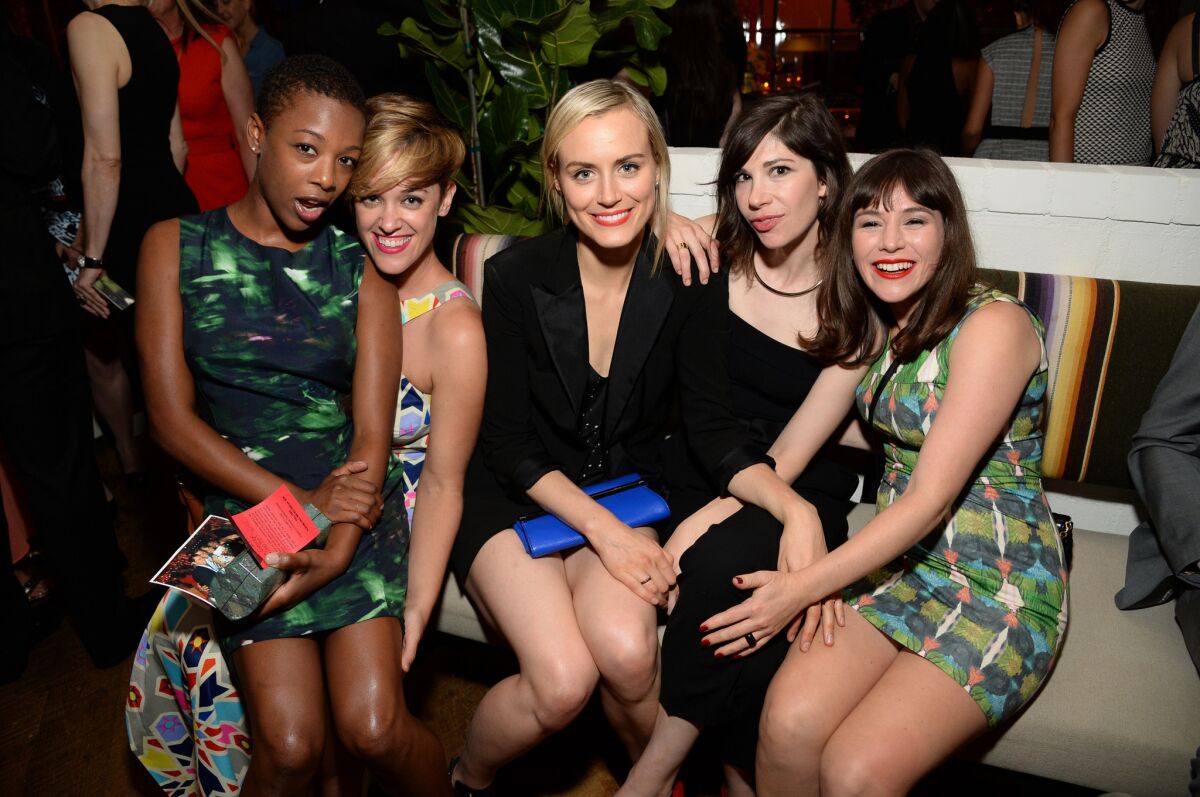 "Orange Is the New Black" actress Samira Wiley, left, gets close with writer Lauren Morelli at an Emmy-nominee event also attended by "OITNB" cast members Taylor Schilling, center, and Yael Stone, right, as well as "Portlandia" composer Carrie Brownstein.