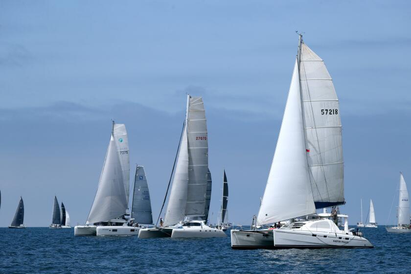 Under clearing skies, the ORCA class Voyager (7275), Wahoo (27070) and Kastor Pollux (57218) take off as the horn sounds for the start of their race, at the 2019 Newport To Ensenada International Yacht Race, off of Newport Beach, on Friday, April 26, 2019.