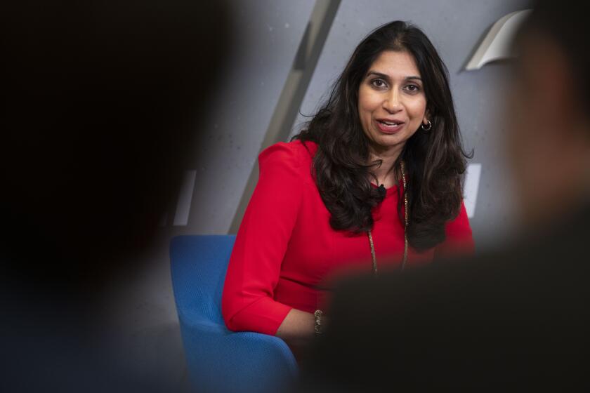 Britain's Home Secretary Suella Braverman answers questions from the audience following a speech on immigration at the American Enterprise Institute on Tuesday, Sept. 26, 2023, in Washington. (AP Photo/Kevin Wolf)