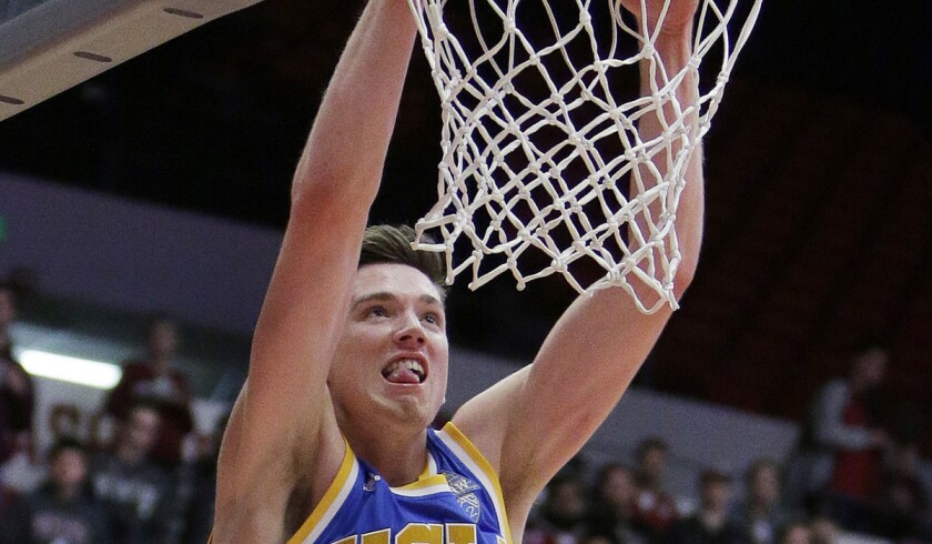 UCLA forward TJ Leaf dunks during the first half against Washington State on Wednesday.
