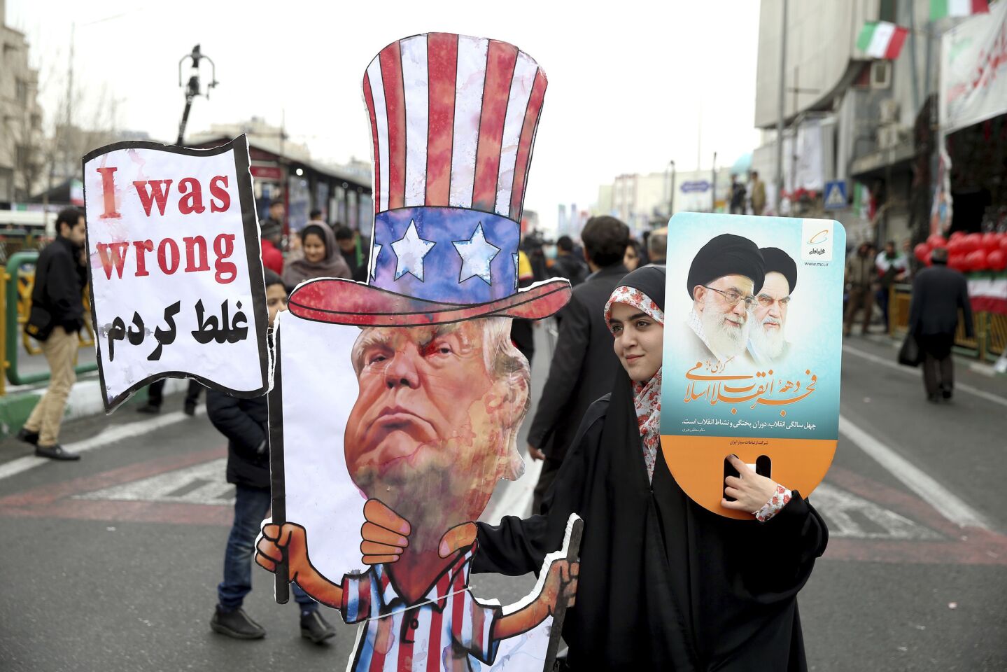 An Iranian woman holds an effigy of President Trump during a rally marking the 40th anniversary of the 1979 Islamic Revolution, in Tehran.