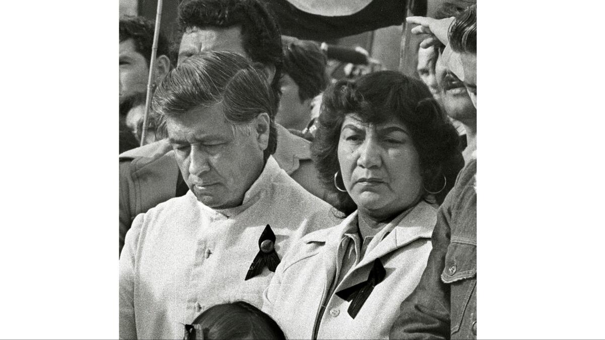 In this file photo, Cesar Chavez and his wife Helen are seen at the graveside service for slain farm worker Rufino Contraras. Helen Chavez died Monday at age 88.