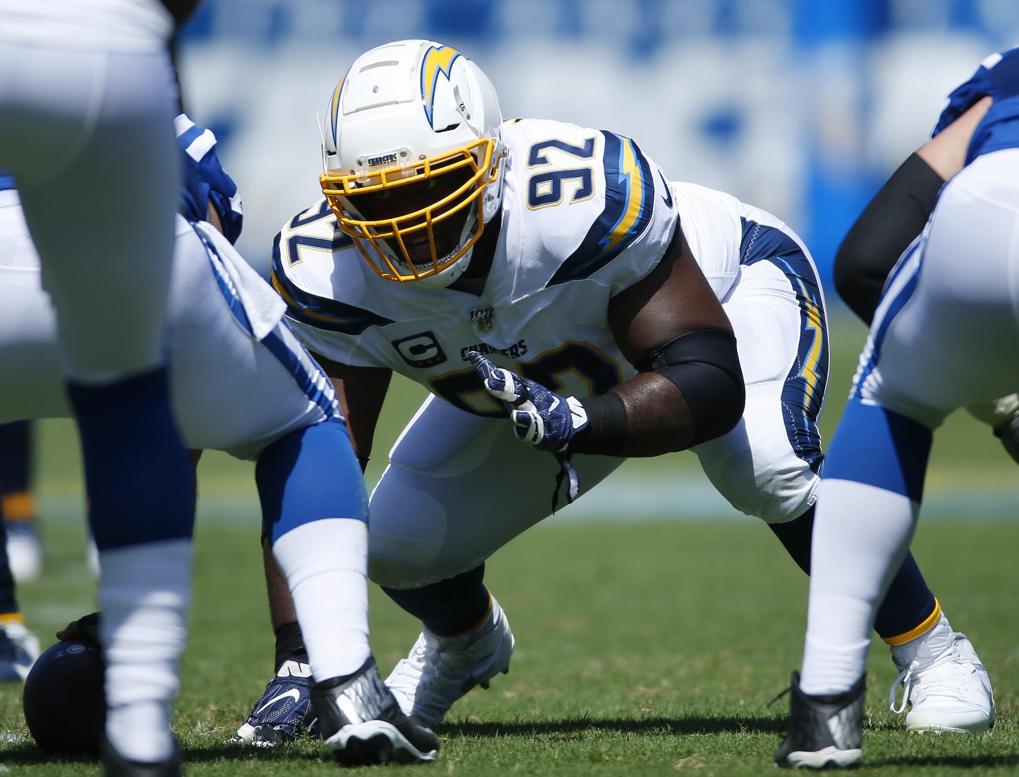 Chargers defensive lineman Brandon Mebane gets set at the line of scrimmage during a game against the Colts.