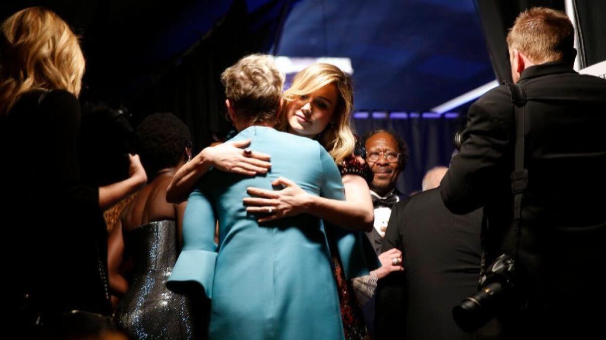 Brie Larson hugs Frances McDormand backstage at the 24th Screen Actors Guild Awards.