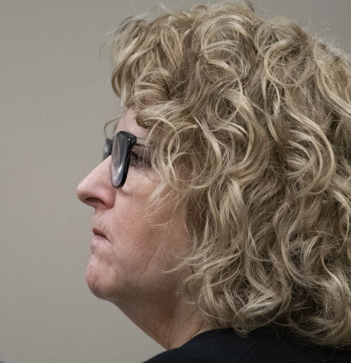 Former Michigan State University womens gymnastics coach Kathie Klages listens to testimony Tuesday, Feb. 11, 2020, at Veterans Memorial Courthouse in Lansing, Mich., where she's on trial for two counts of lying to police during a 2018 interview. Klages denies that two gymnasts told her in 1997 that Larry Nassar, a former MSU sports medicine doctor who abused hundreds of girls and young women under the guise of medical treatment, had sexually abused them. (Matthew Dae Smith/Lansing State Journal via AP)