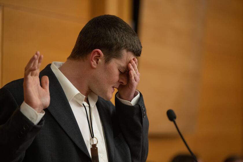 A man struggles to testify in a court of law.