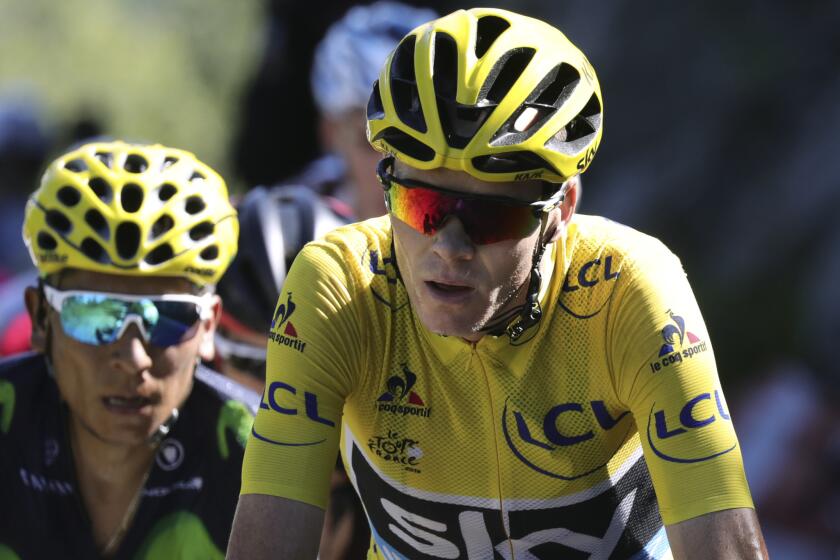 Chris Froome leads Nairo Quintana during Stage 17 climb of the Tour de France.