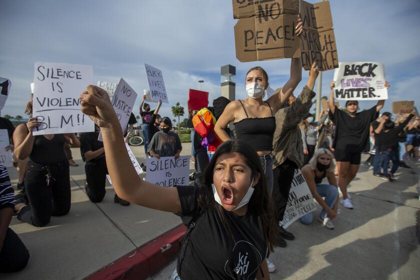 Samantha Hernandez, 14, chants during a a peaceful demonstration near the OC Fair and Event Center on Tuesday, June 2.