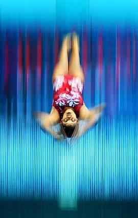 A Commonwealth Games competitor practices a dive from the 5-meter board on Saturday in Delhi, India.