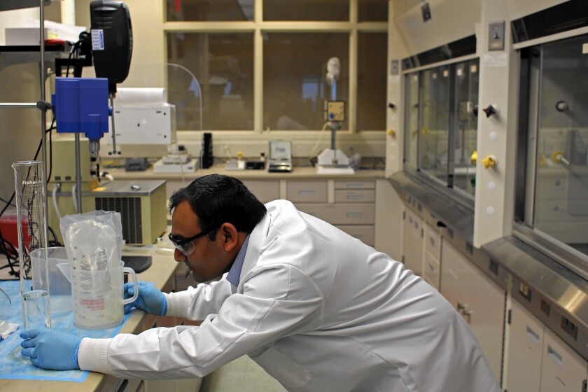 Sanjay Patel, a research scientist with Akorn Pharmaceuticals, works in a lab in this 2012 file photo. A deal between Akorn and Germany's Fresenius fell apart after regulators questioned its operational procedures.
