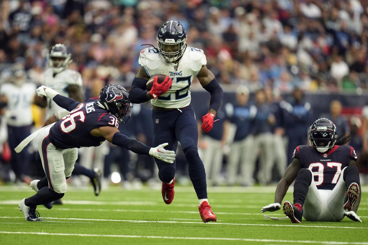 Tennessee Titans running back Derrick Henry runs for a touchdown against the Houston Texans on Sunday.